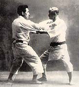 Jigoro Kano (right) practicing Judo